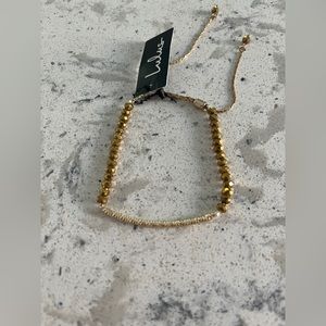 Lulu’s gold beaded bracelet